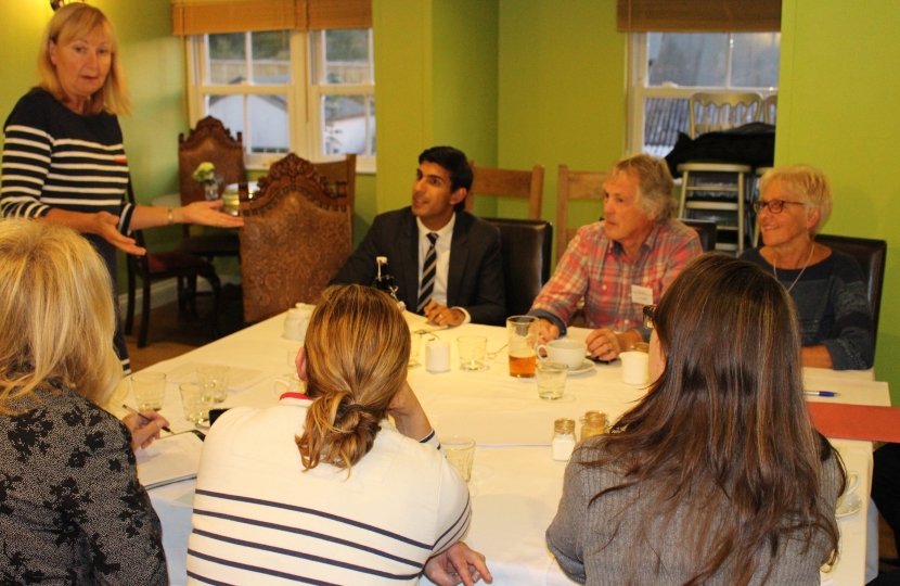 Rishi listens to the presentation of the Brompton Flood Protection Group