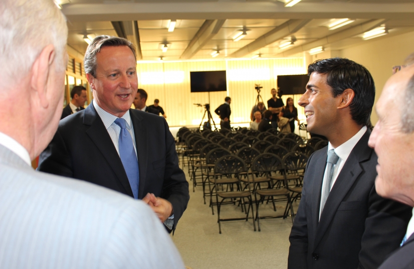 The Prime Minister talks with Simon Bailes, right, John Gibson, left, and Rishi