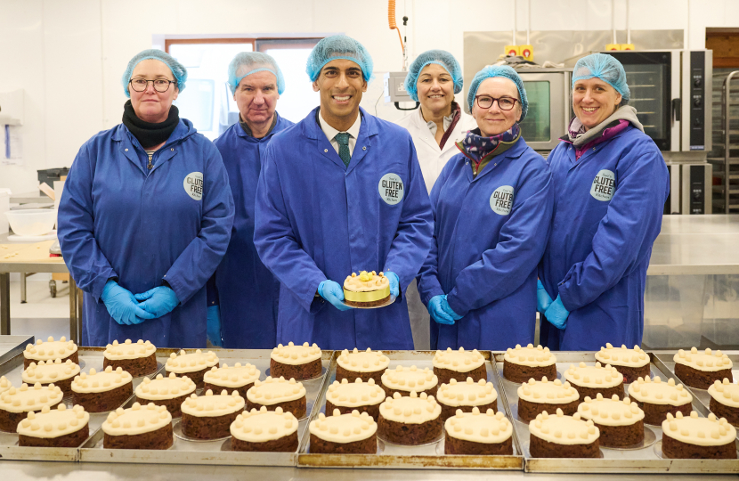 Rishi with Gluten Free Kitchen staff and traditional Simnel cakes