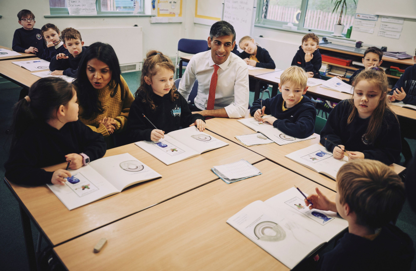 Rishi and Akshata with pupils