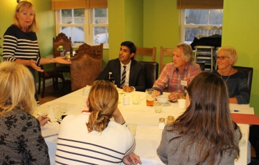 Rishi listens to the presentation of the Brompton Flood Protection Group